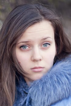 Portrait of pretty young girl outdoors.