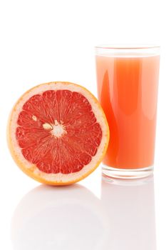 Glass of grapefruit juice isolated on white.