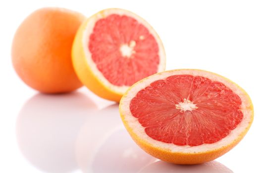 Half of fresh grapefruit on white background.
