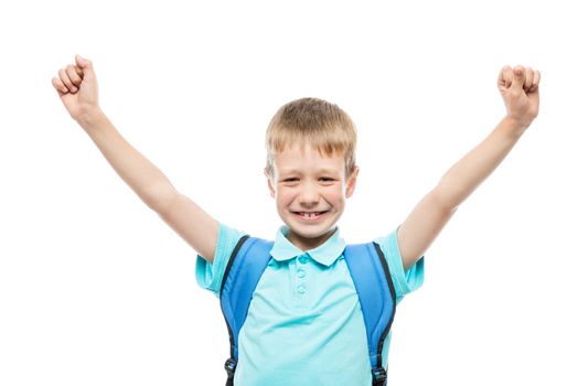 boy 8 years old with his hands up happy, portrait isolated
