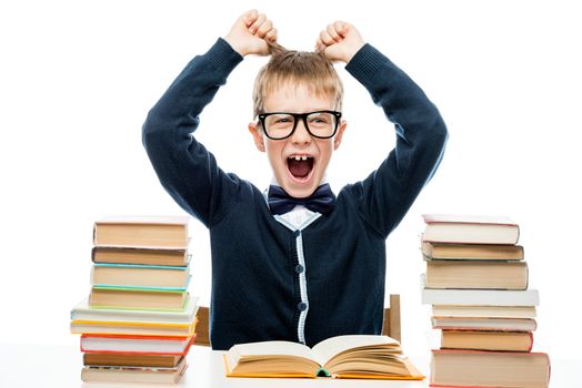 schoolboy tearing hair on head during stress, portrait isolated