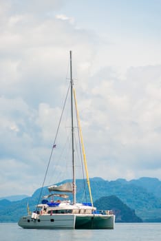 luxury white yacht vertical photograph on the background of the mountains