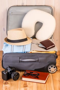 preparation of a suitcase for long flight, objects close-up