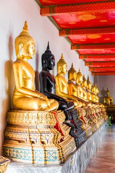 a series of seated Buddhas in a Thai temple in Bangkok