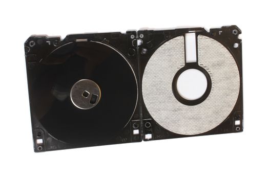 An old floppy used for storing data stripped down showing its magnetic disc.
