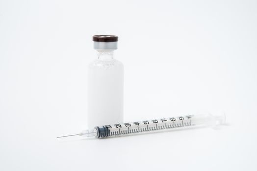 Insulin ampoule with syringe lie