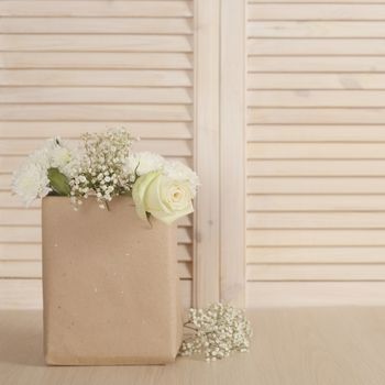 Valentine day bouquet of flowers in paper bag