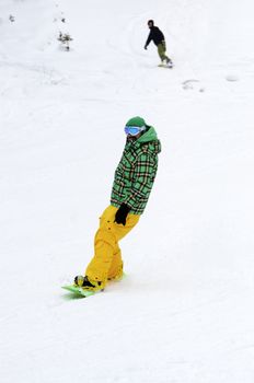 Men skiing on the mountain under snow