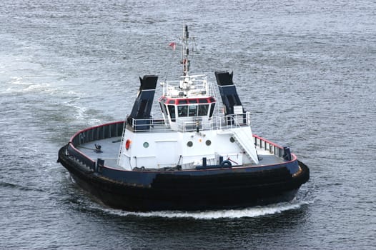 High angle view on tug boat at sea