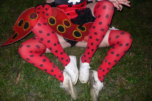 Two women in carnival costume showing just legs