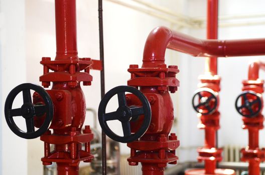 Colorful valves in industrial plant on pipes