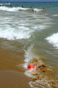 Waves on the beach on sunny summer day