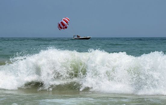 Waves on the beach on sunny summer day