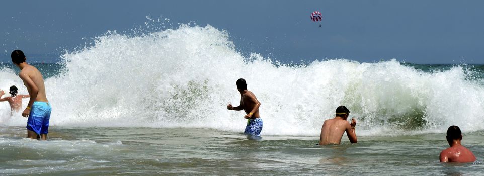 Waves on the beach on sunny summer day