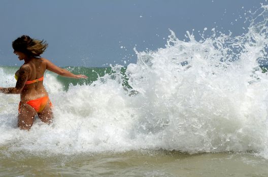 Waves on the beach on sunny summer day