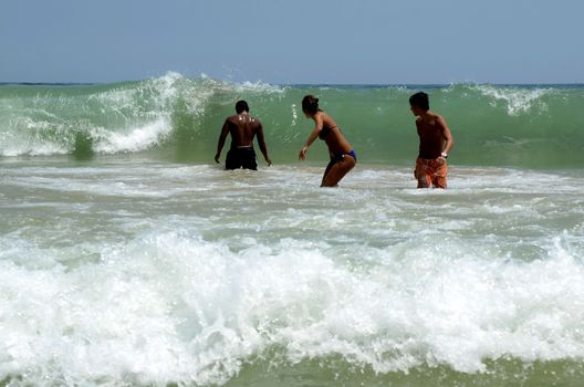 Waves on the beach on sunny summer day