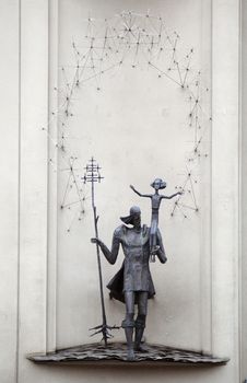 Metal statue of a man with a girl in Vilnius, Lithuania