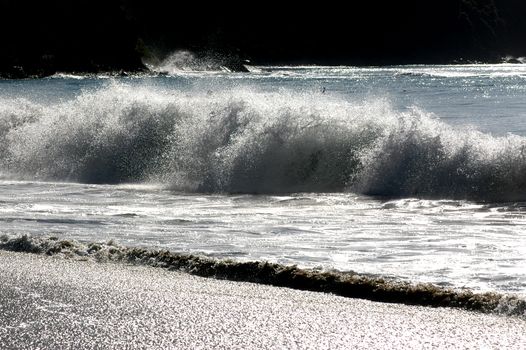 Waves on the beach on sunny summer day