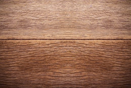 Milk bottle on brown wooden background. Top view with copy space.