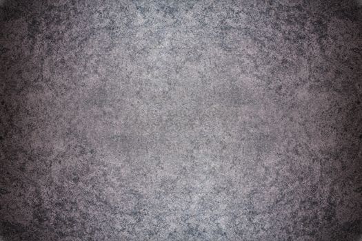 Grey textured concrete wall. Dark edges