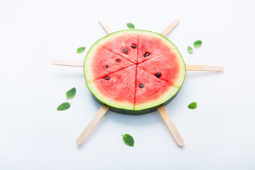 Fresh and sweet watermelon slice popsicles on white background