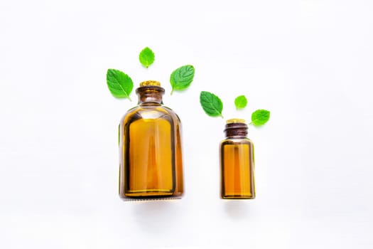 Natural Mint Essential Oil in a Glass Bottle with Fresh