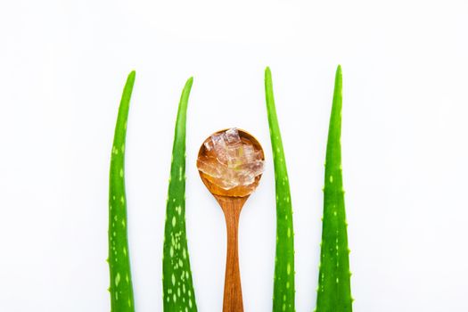 Aloe vera fresh leaves with aloe vera gel on wooden spoon. isolated over white