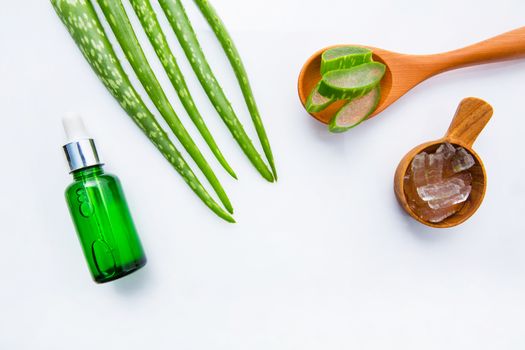 Bottle of products for spa or skin care cosmetic aloe vera gel and Aloe Vera leaves isolated on white background