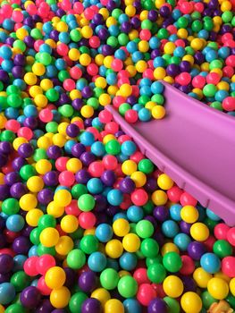 dry children's pool with colorful balls