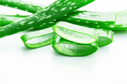 Aloe vera fresh leaves with slices aloe vera gel. isolated over white with copy space.