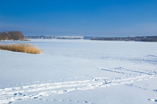 Winter paysage landscape of frozen lake river under snow