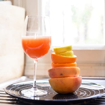 citrus fruit squeezed in the kitchen stacked peels to form a tower, citrus juice vitamin