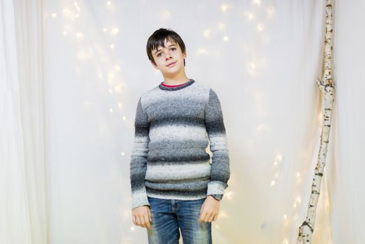 portrait of male teenager in the studio while smiling, pimples on the face