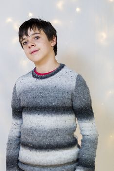 portrait of male teenager in the studio while smiling, pimples on the face