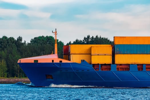 Blue container ship. Global logistics and merchandise transfer