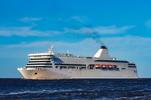 White cruise liner sailing on a clear day