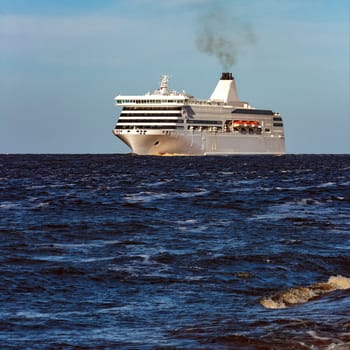 White cruise liner sailing on a clear day