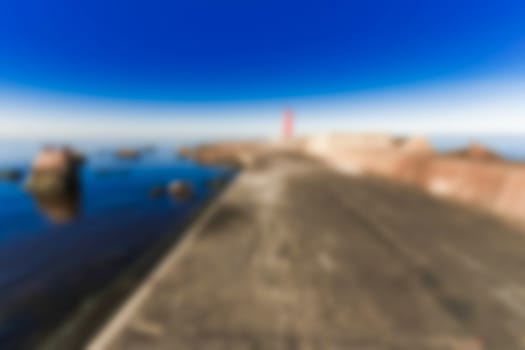 Red lighthouse - soft lens bokeh image. Defocused background