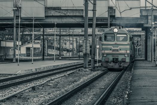 Old diesel cargo locomotive. Freight train in action