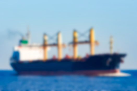 Cargo ship - soft lens bokeh image. Defocused background