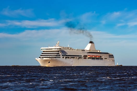 White cruise liner sailing on a clear day