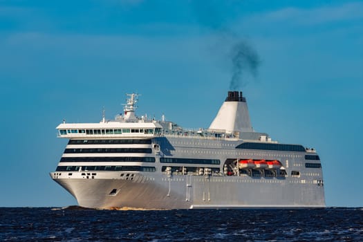 White cruise liner sailing on a clear day