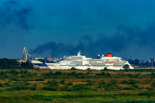 White cruise liner in Riga city. Tour travel and spa services