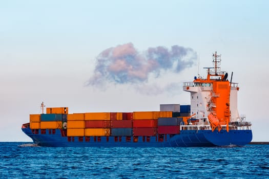 Blue container ship. Global logistics and merchandise transfer