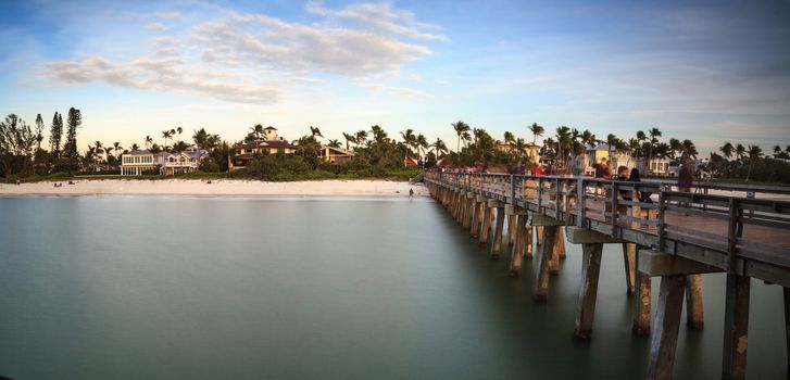 Naples Pier on the beach at sunset in Naples, Florida, USA