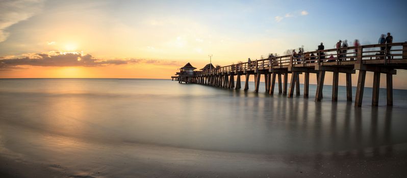 Naples Pier on the beach at sunset in Naples, Florida, USA