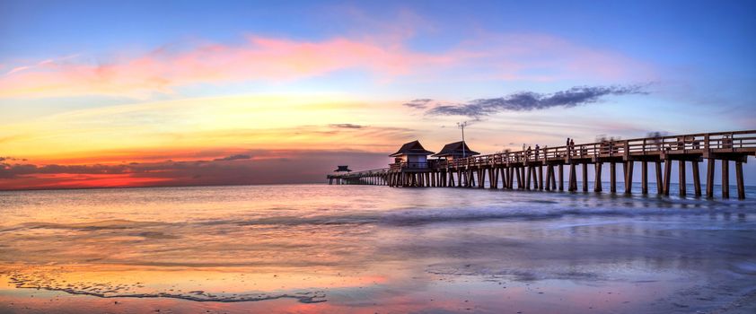 Naples Pier on the beach at sunset in Naples, Florida, USA