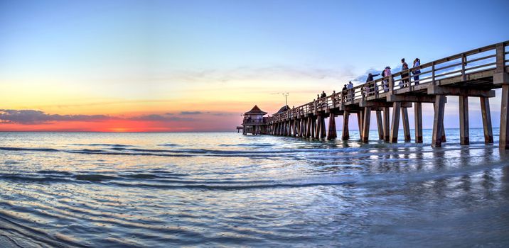 Naples Pier on the beach at sunset in Naples, Florida, USA