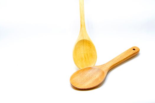 Two Brown wooden spoon on white background