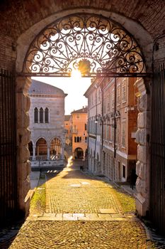 Town of Udine ancient gate aut sunset view, Piazza della Liberta square, Friuli-Venezia Giulia region of Italy